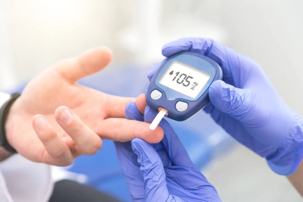 Close-up photograph of a professional blood glucose test displaying '105', an example of covered screenings in the Medicare prevention program.